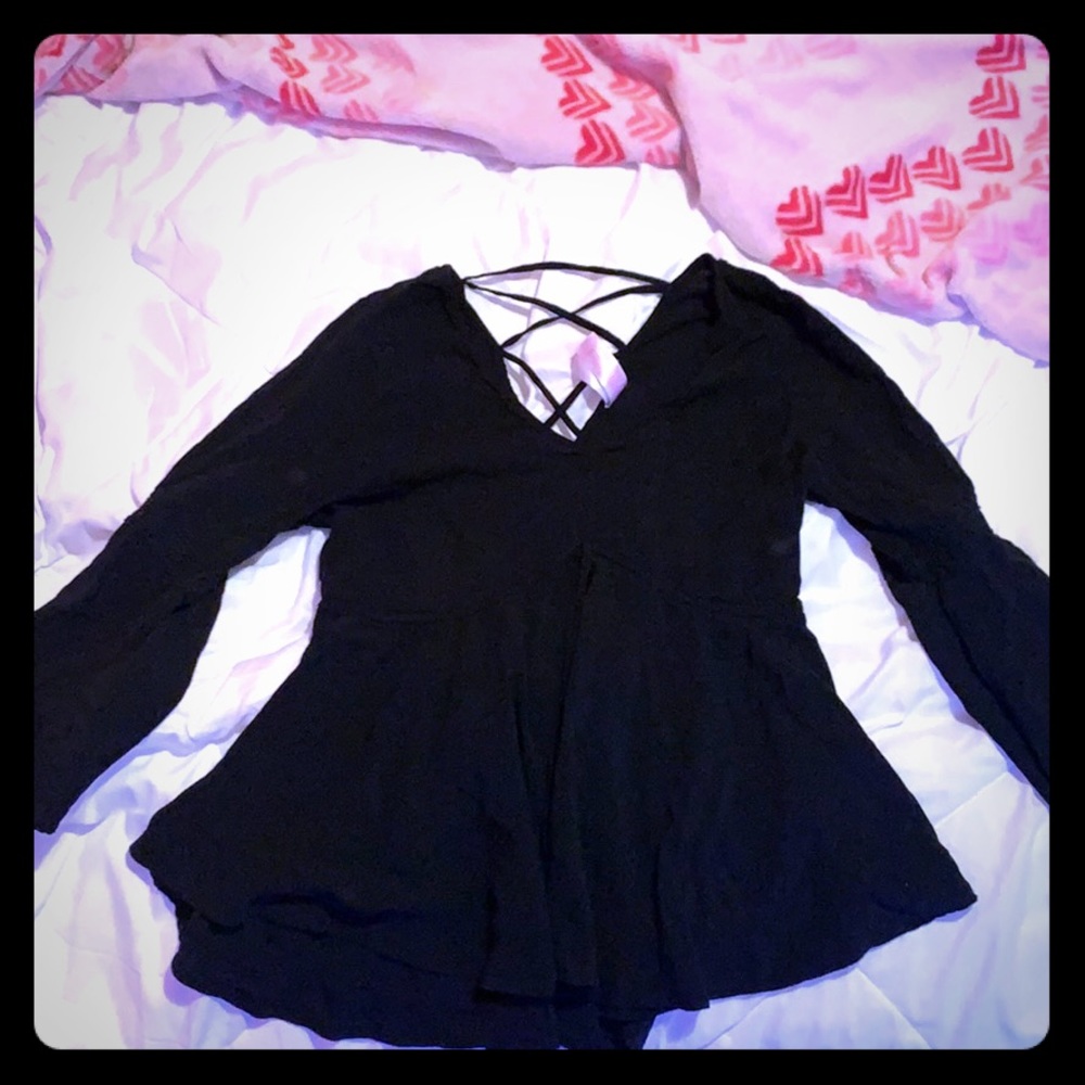 A black airy long sleeved shirt